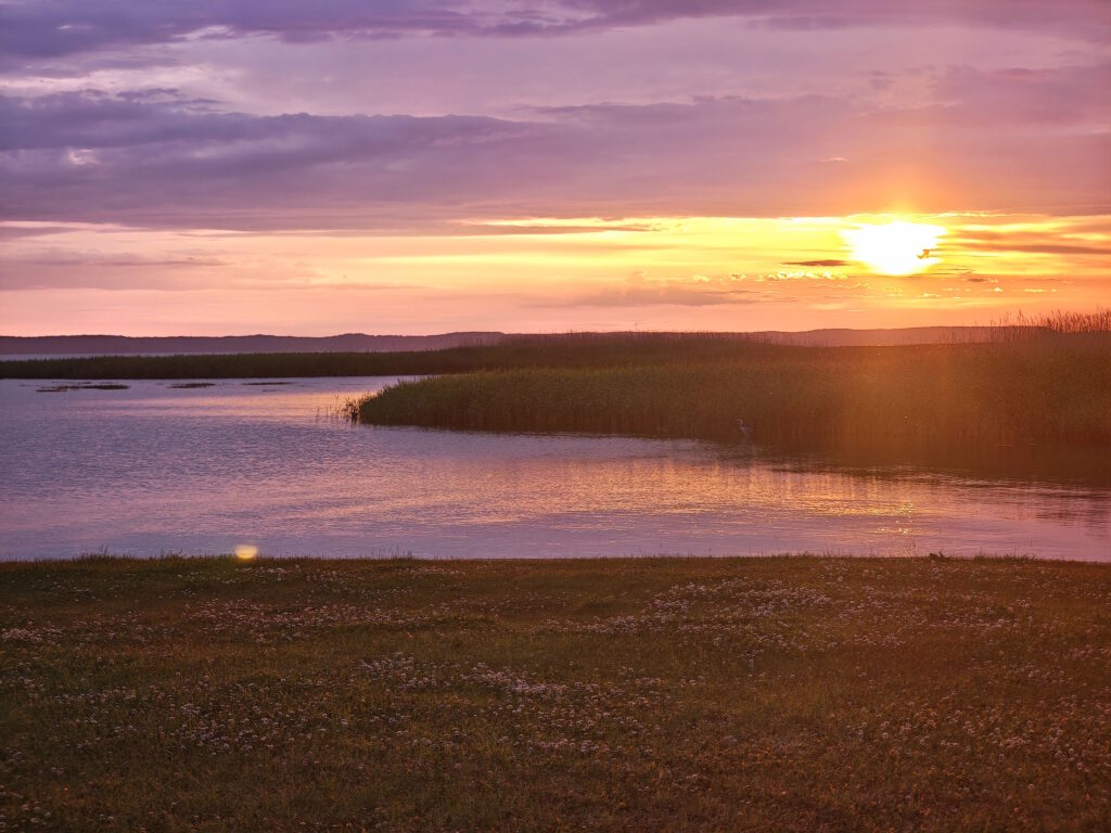 Kurisches Haff mit Sonnenuntergang - in Svencelė